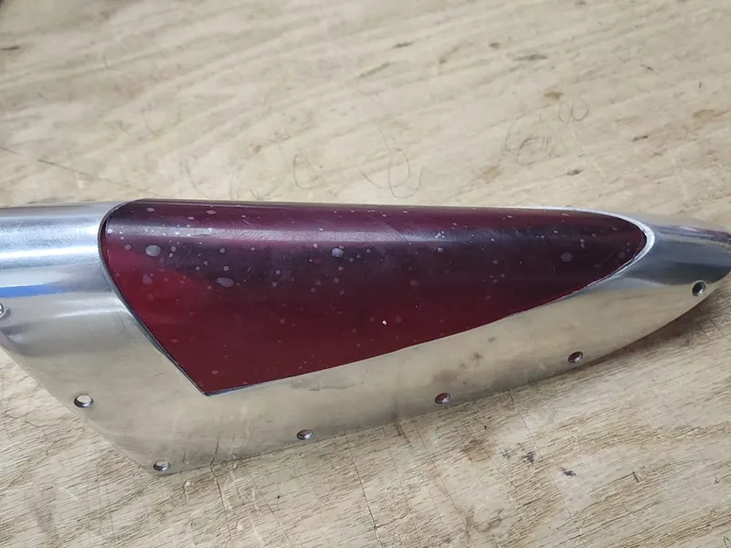 Red acrylic lens in a polished housing