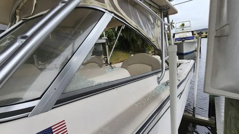 Side window shattered, glass on the deck
